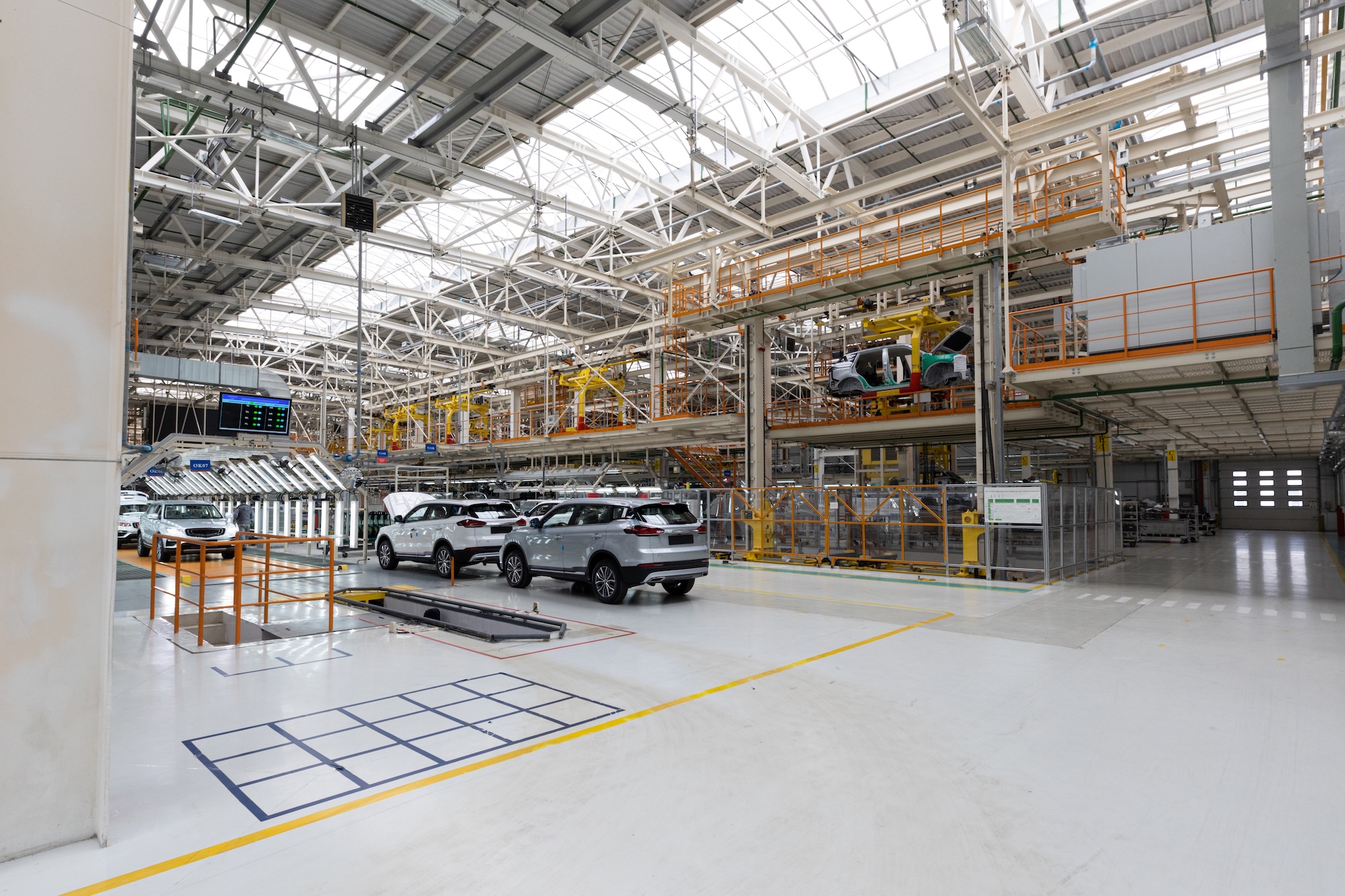 State-of-the-art automotive manufacturing facility showcasing advanced production lines, automated systems, and modern industrial operations