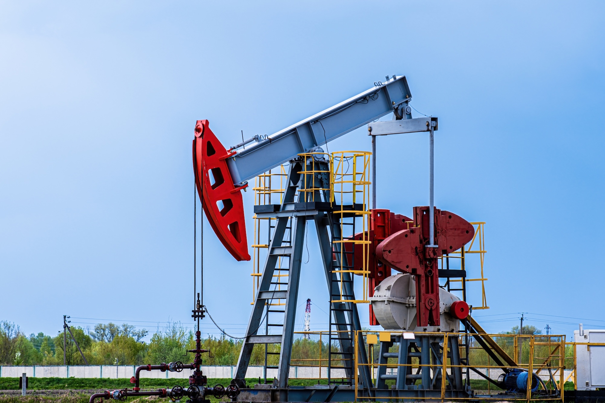 Industrial oil and gas pumpjack equipment showcasing modern petroleum production operations and energy sector management